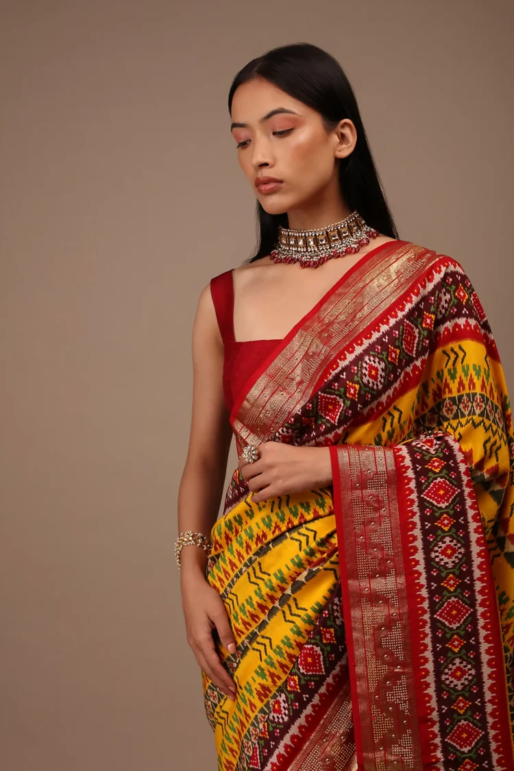 Chrome Yellow Saree In Silk With Multi Colored Patola And Foil Print And Contrasting Maroon Border