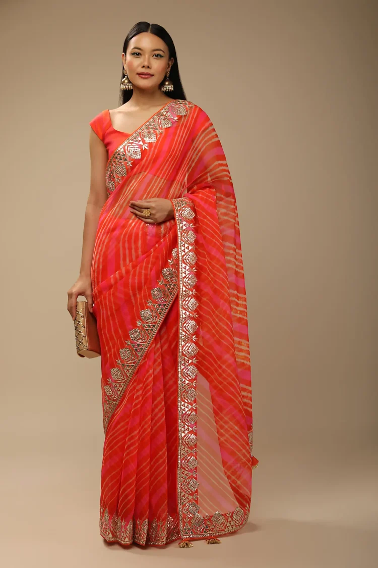 Orange And Fuchsia Dual Toned Saree In Organza With Lehariya Print And Gotta Patti Embroidered Geometric Floral Border
